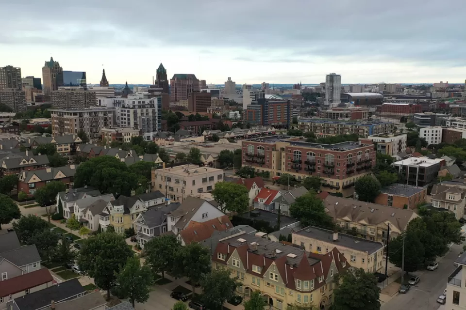 Aerial view of Milwaukee, Wisconsin skyline with large old homes in the foreground